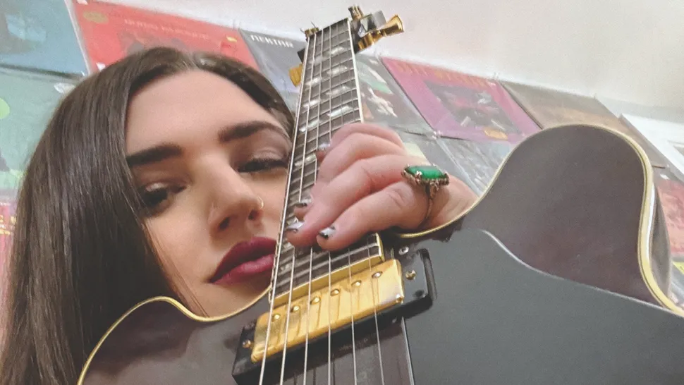 Ella Feingold with guitar